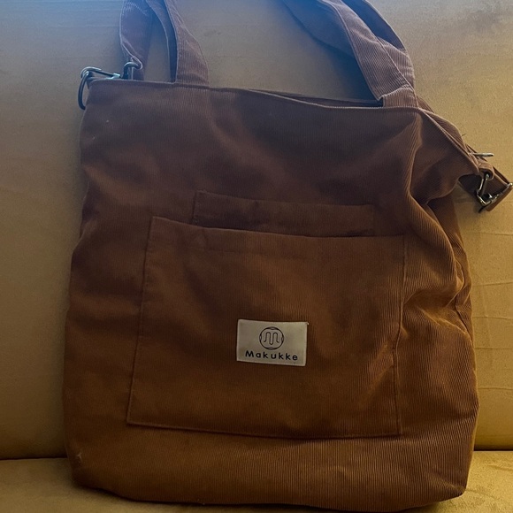 Handbags - Brown corduroy sack type purse. Two inside pockets and two outside pockets.